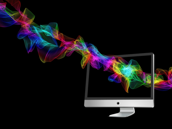 Obrazek przedstawia płaski monitor komputerowy, przez którego ekran przechodzi smuga w różnych kolorach.